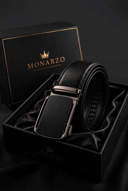 Monarzo Eclipse black textured leather auto-lock belt displayed in a black gift box with gold branding.