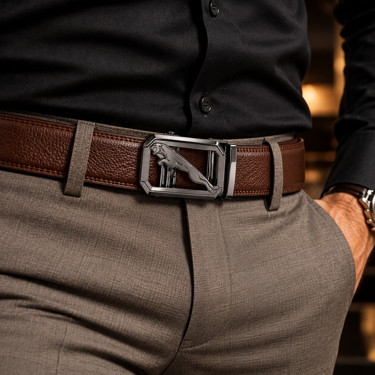 Men's brown textured genuine leather auto lock belt styled with a black shirt and grey formal trousers.